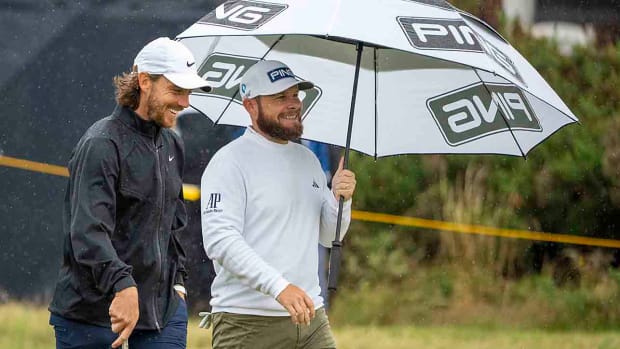 Tommy Fleetwood (left) and Tyrrell Hatton talk on the fourth hole during a practice round at the 2023 British Open.